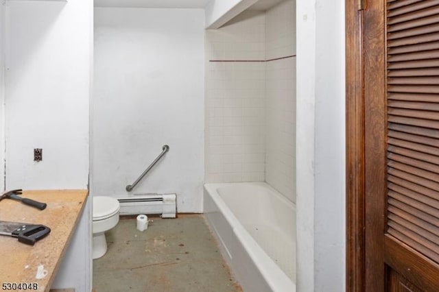 bathroom featuring a baseboard radiator, a tub to relax in, vanity, and toilet