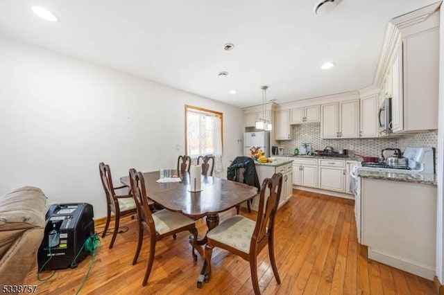 dining area with light hardwood / wood-style flooring