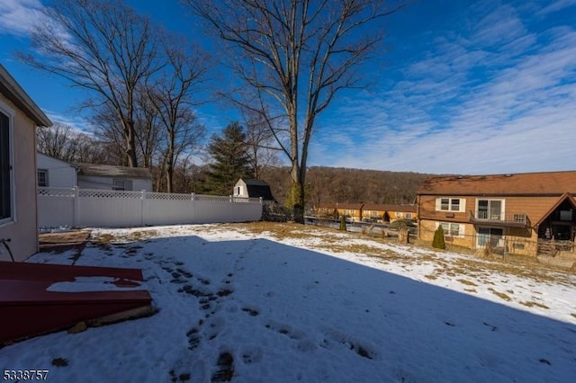 view of yard covered in snow