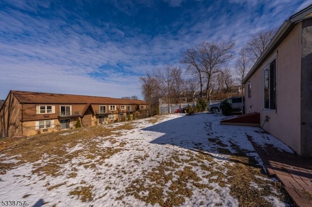 view of yard covered in snow