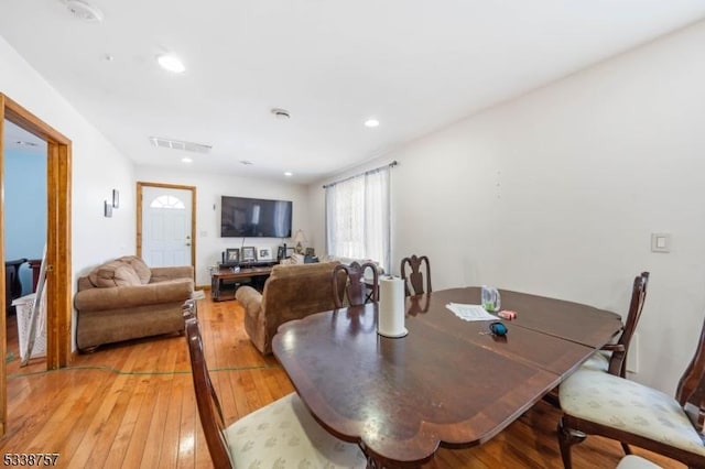 dining area with light hardwood / wood-style floors