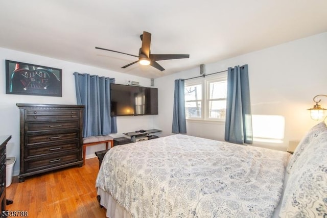 bedroom featuring hardwood / wood-style flooring and ceiling fan