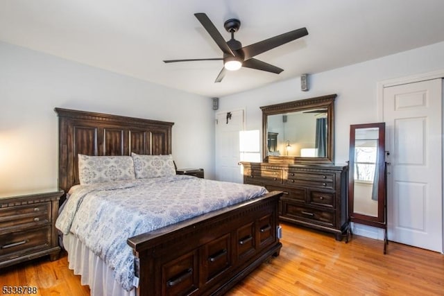 bedroom featuring ceiling fan and light hardwood / wood-style flooring