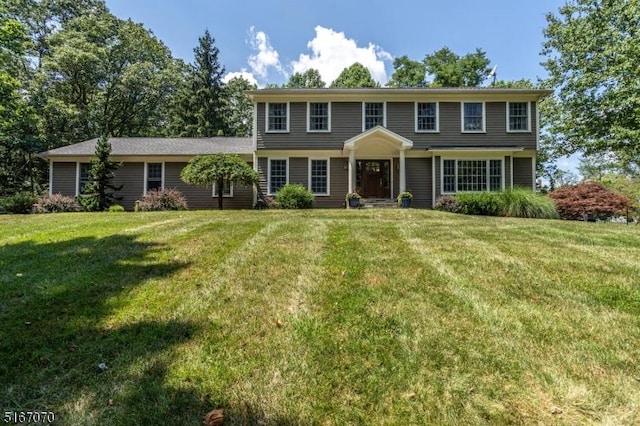 colonial home with a front yard