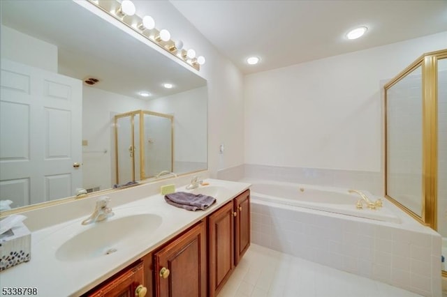 full bath with a garden tub, double vanity, a stall shower, a sink, and tile patterned floors