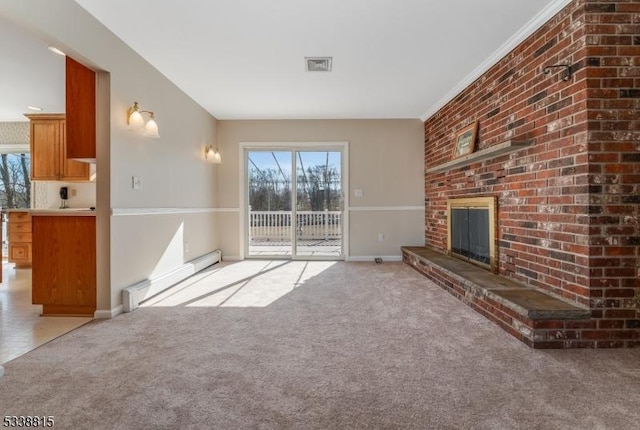 unfurnished living room featuring light carpet, baseboard heating, and a healthy amount of sunlight