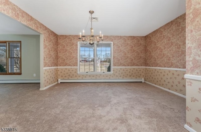 unfurnished dining area featuring a notable chandelier, carpet, a baseboard radiator, and wallpapered walls