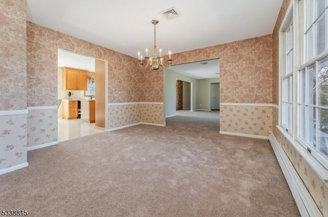 empty room featuring carpet floors, a baseboard radiator, visible vents, and wallpapered walls