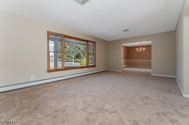 carpeted empty room with an inviting chandelier, a baseboard radiator, visible vents, and baseboards