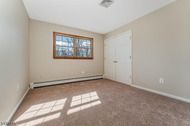 unfurnished bedroom with a baseboard radiator, a closet, light colored carpet, visible vents, and baseboards