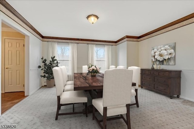 dining space featuring baseboards and ornamental molding