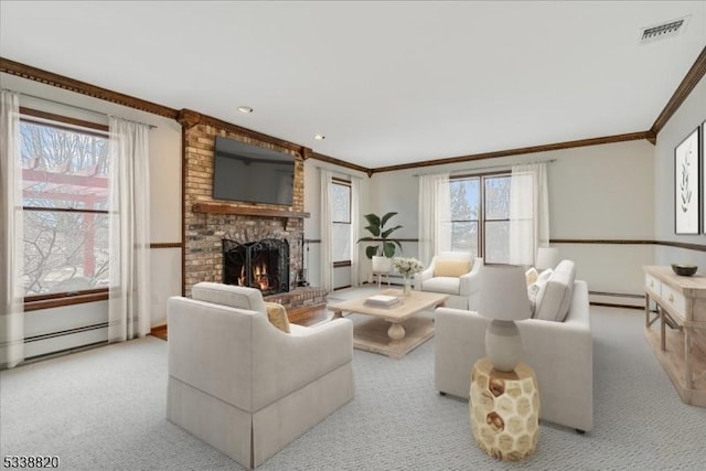 living area with a wealth of natural light, a fireplace, visible vents, and crown molding