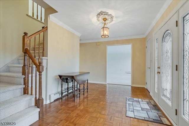 foyer with baseboards, stairway, and crown molding