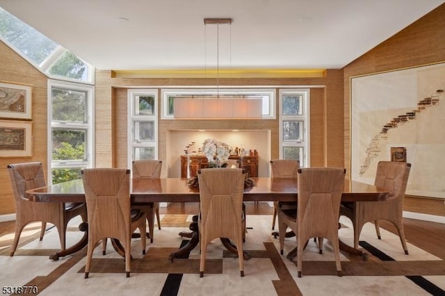 dining room with lofted ceiling