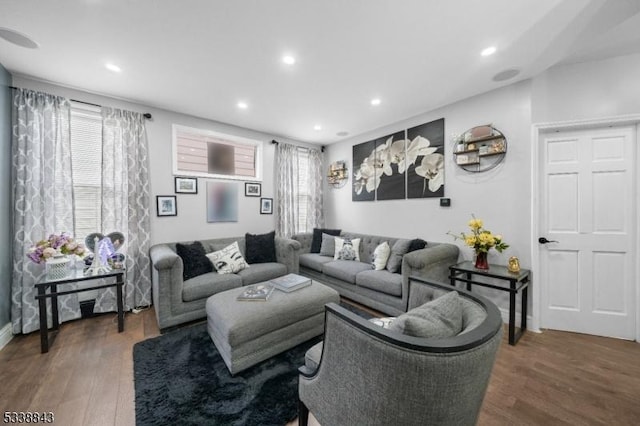 living room featuring a healthy amount of sunlight, wood finished floors, and recessed lighting