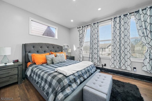 bedroom featuring multiple windows, wood finished floors, and recessed lighting