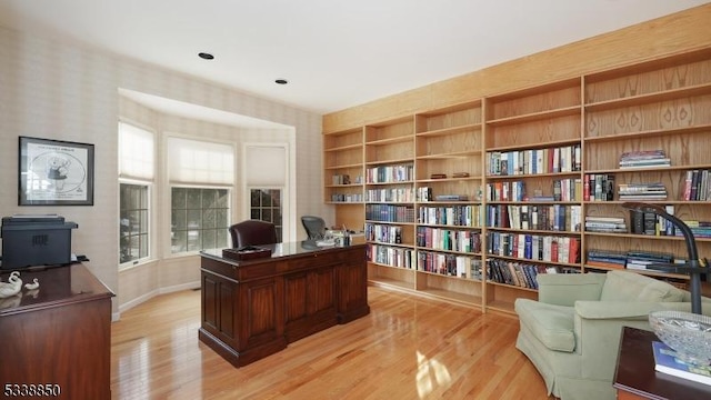 home office featuring light wood-style flooring and baseboards