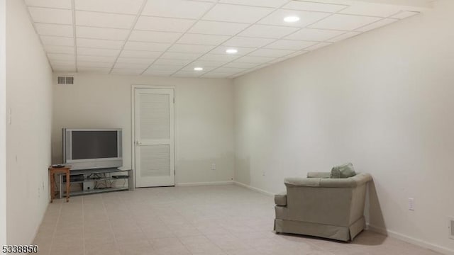 sitting room featuring recessed lighting, a drop ceiling, visible vents, and baseboards