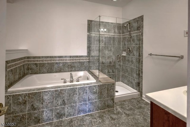 bathroom featuring a garden tub, tile patterned flooring, vanity, and a stall shower