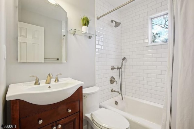 bathroom featuring toilet, shower / tub combination, and vanity