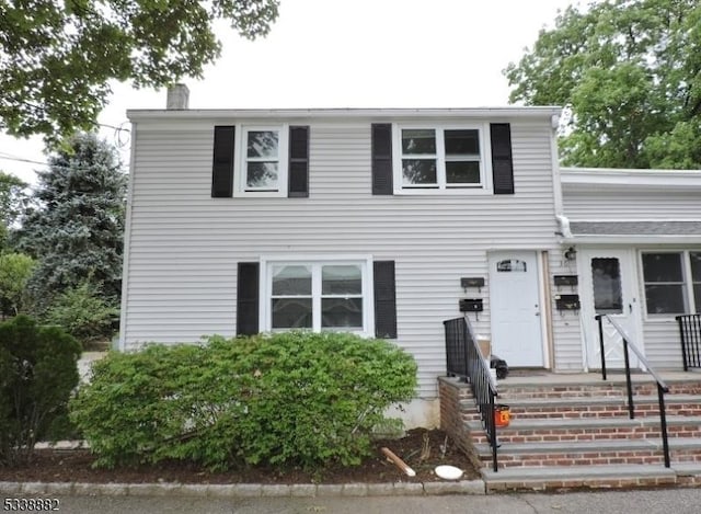 view of front of property featuring a chimney