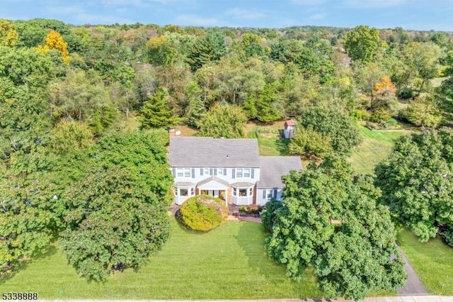 aerial view with a wooded view