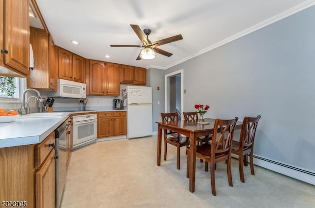 kitchen featuring tasteful backsplash, white appliances, ceiling fan, ornamental molding, and sink