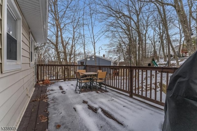 view of snow covered deck