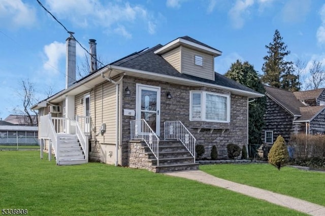 bungalow-style home with a front lawn