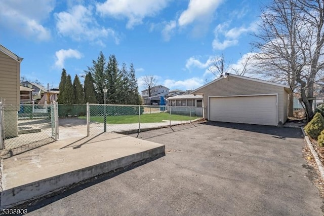 exterior space with a garage and an outdoor structure