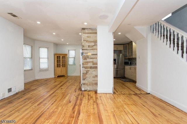 unfurnished living room with light hardwood / wood-style flooring