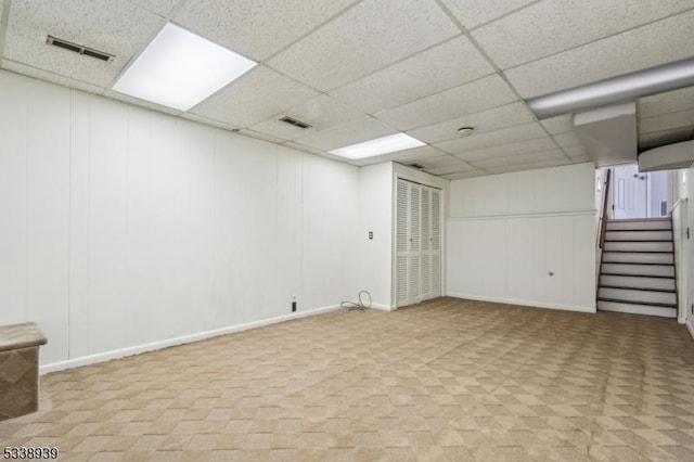 basement featuring a paneled ceiling