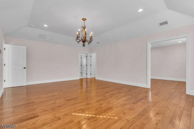 interior space with vaulted ceiling, light wood-style floors, recessed lighting, and baseboards