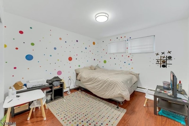 bedroom with hardwood / wood-style floors