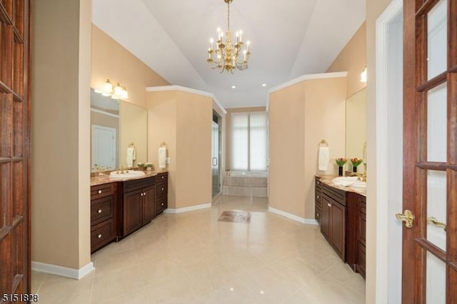 full bath featuring lofted ceiling, baseboards, two vanities, and a sink