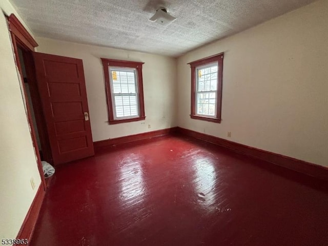 empty room featuring a textured ceiling