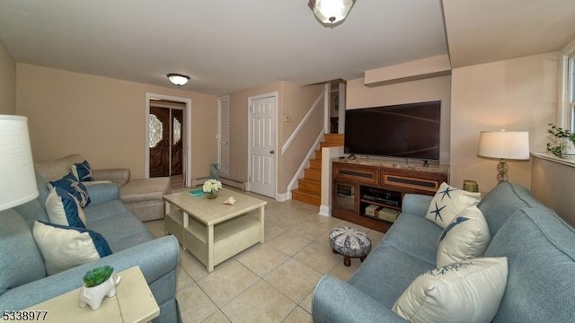 living area featuring light tile patterned floors, stairway, and a baseboard heating unit