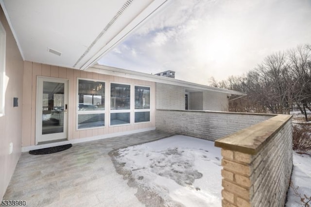 view of snow covered patio