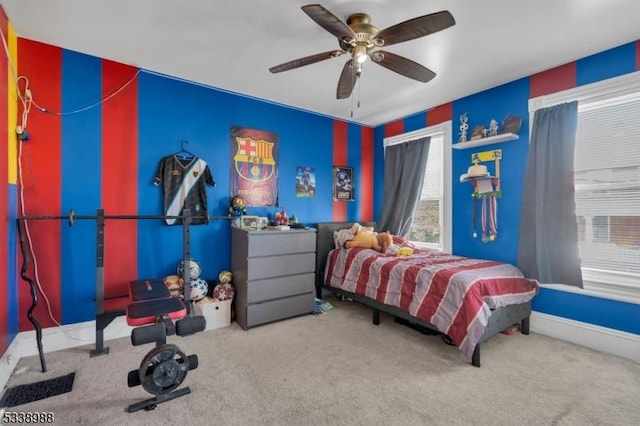 bedroom with ceiling fan and carpet flooring