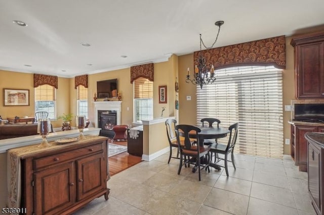 kitchen with light tile patterned flooring and decorative light fixtures