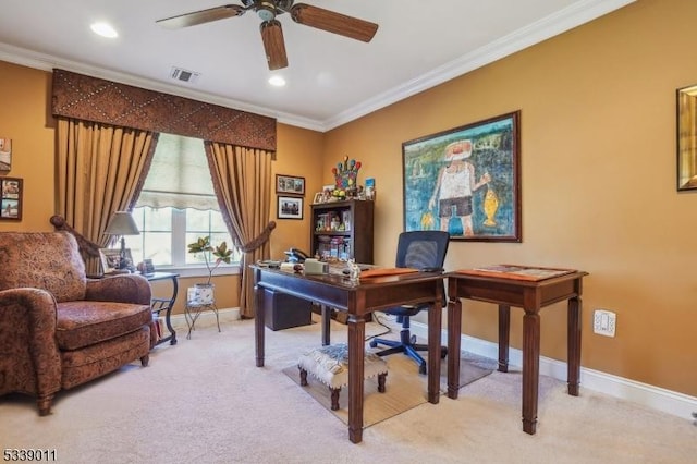 carpeted office space with ceiling fan and ornamental molding