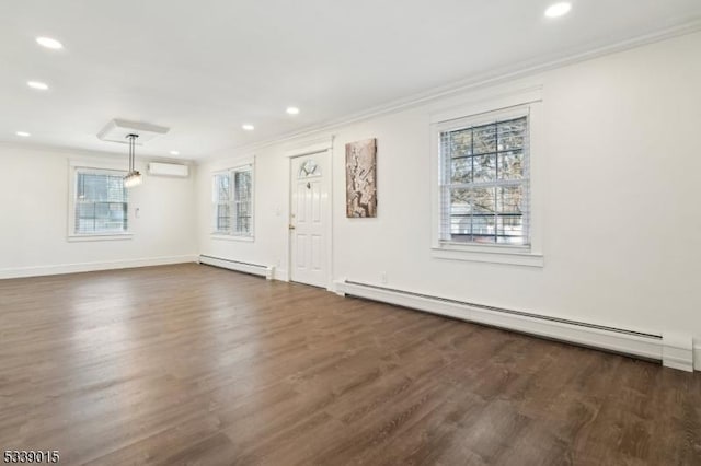 unfurnished living room with an AC wall unit, crown molding, a baseboard heating unit, and dark hardwood / wood-style floors