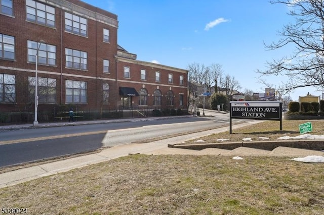 view of road with sidewalks and curbs