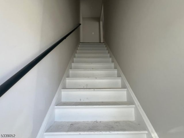 stairs featuring baseboards