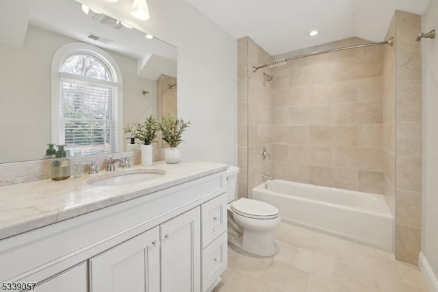 full bath featuring tile patterned flooring, toilet, shower / bath combination, visible vents, and vanity