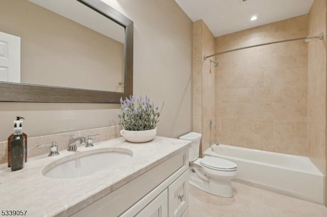 full bathroom featuring toilet, shower / bath combination, and vanity