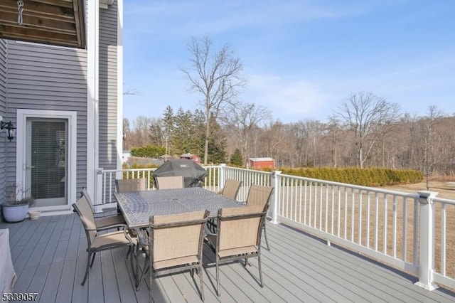 wooden deck with outdoor dining space