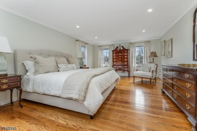 bedroom featuring ornamental molding, recessed lighting, and light wood finished floors