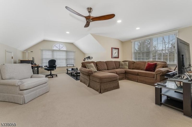 living room featuring vaulted ceiling, recessed lighting, a ceiling fan, and light colored carpet