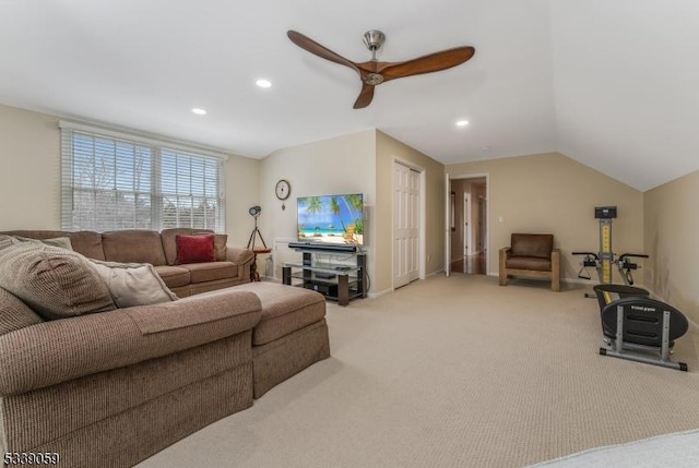 living room featuring vaulted ceiling, ceiling fan, recessed lighting, and light colored carpet